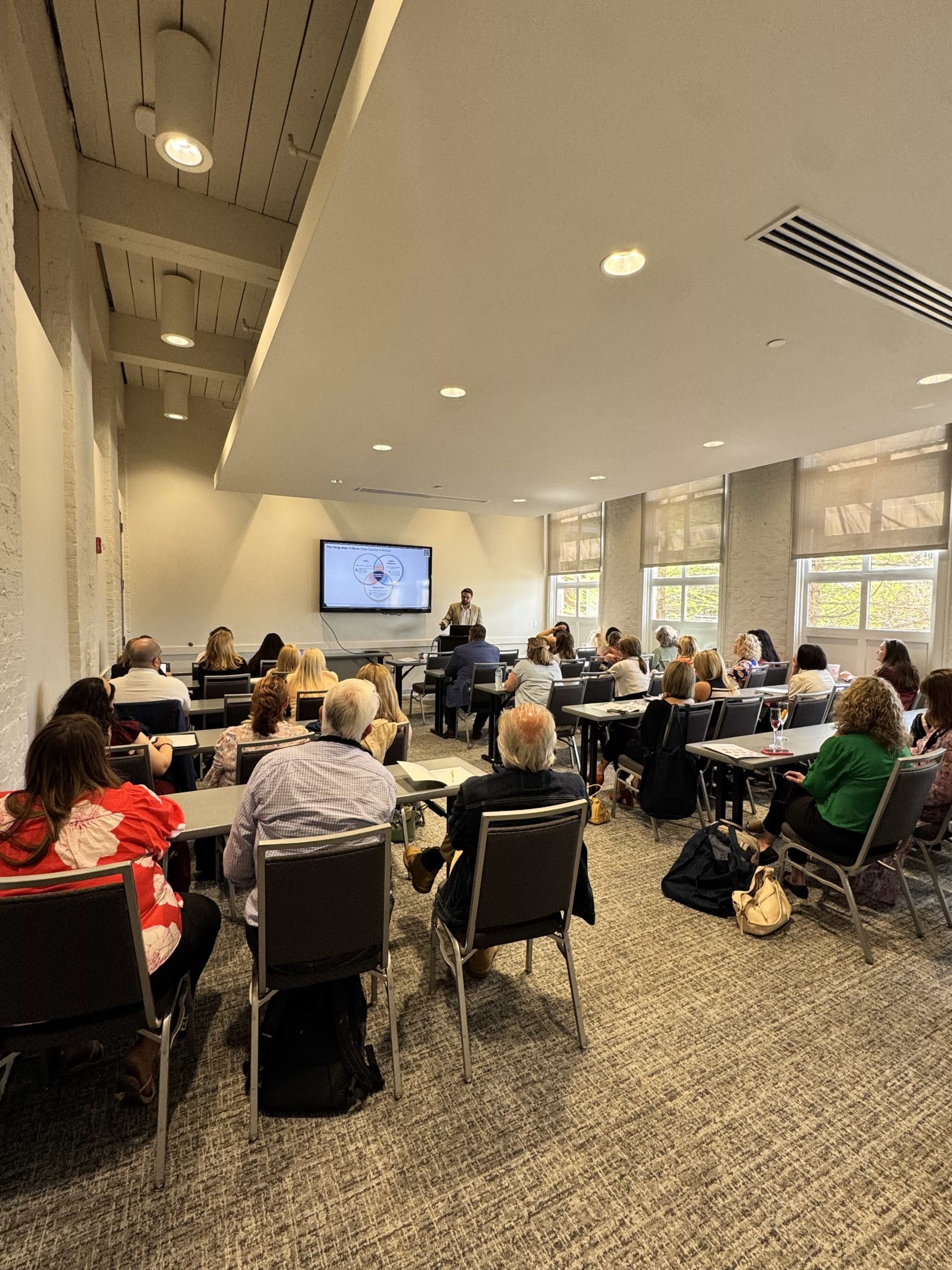 Dr. Kollin Napier presenting on AI in tourism at the Mississippi Tourism Association Spring Tourism Summit in Starkville