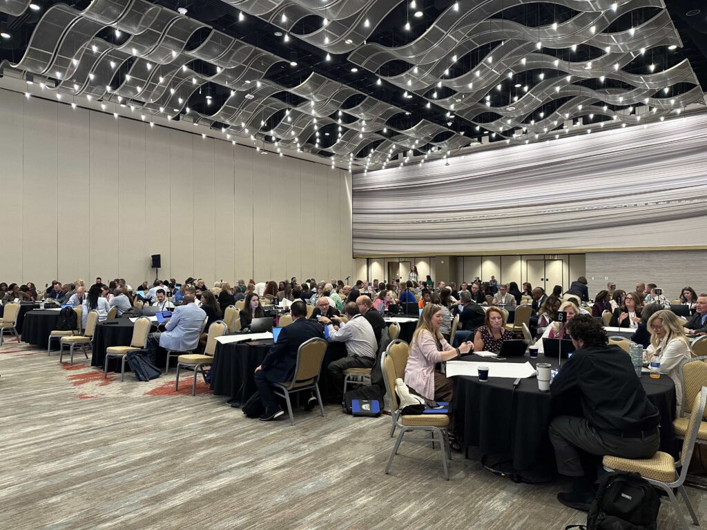 Higher education leaders collaborate during Dr. Kollin Napier's SACSCOC Summer Institute AI session in Atlanta