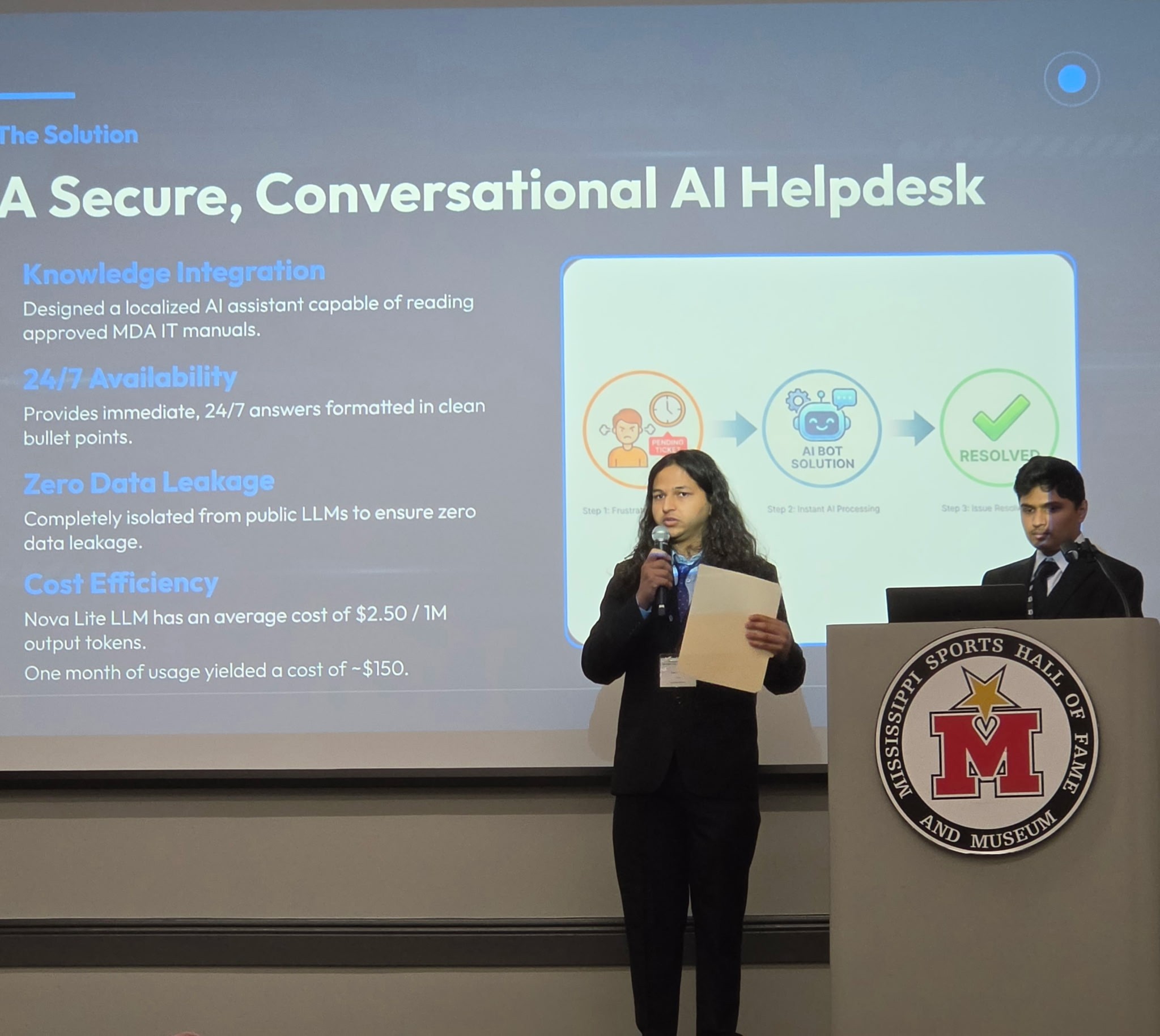 Students present a secure conversational AI helpdesk at the 2026 Mississippi AI Innovation Hub Showcase.
