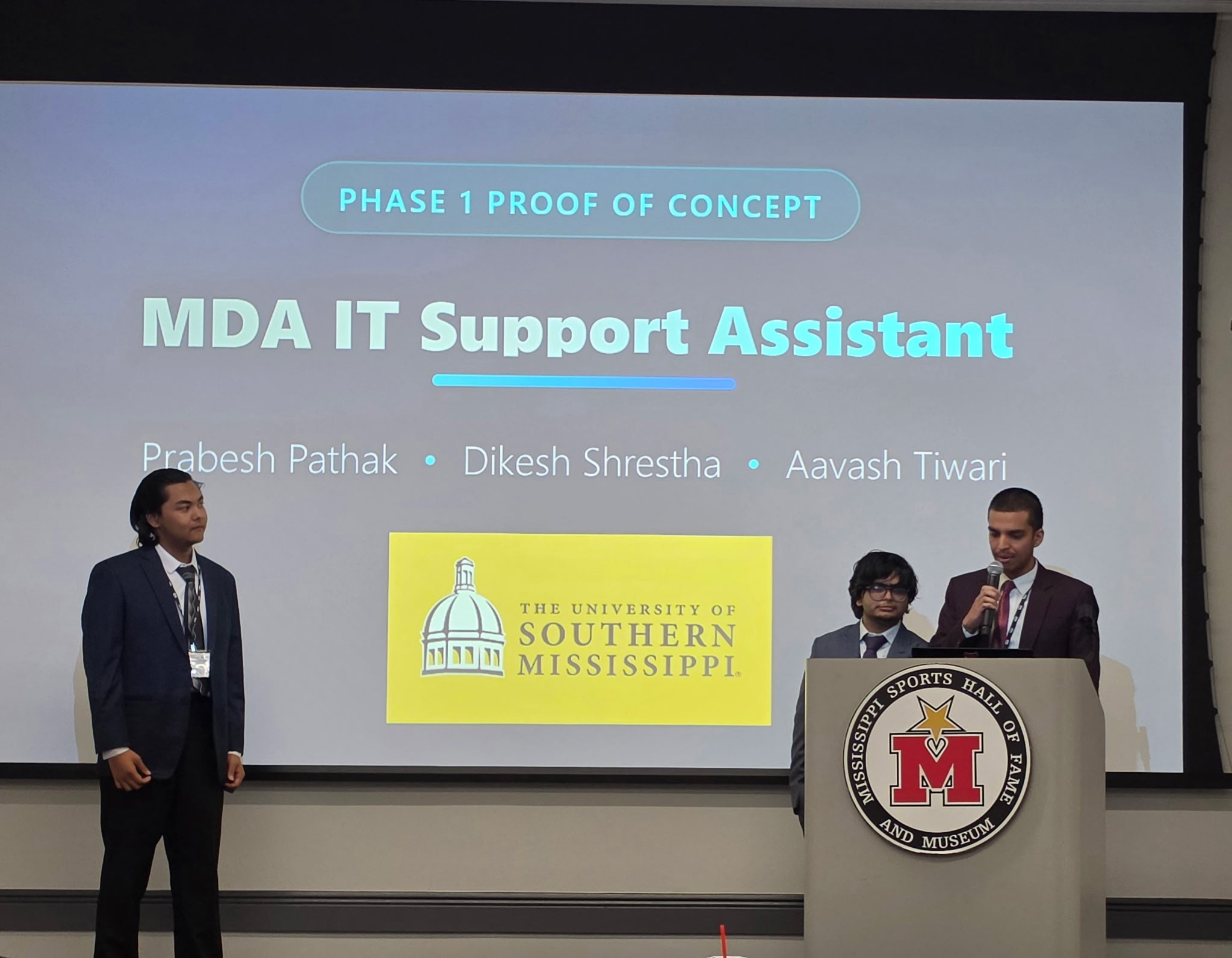 University of Southern Mississippi students present the MDA IT Support Assistant at the 2026 Mississippi AI Innovation Hub Showcase.