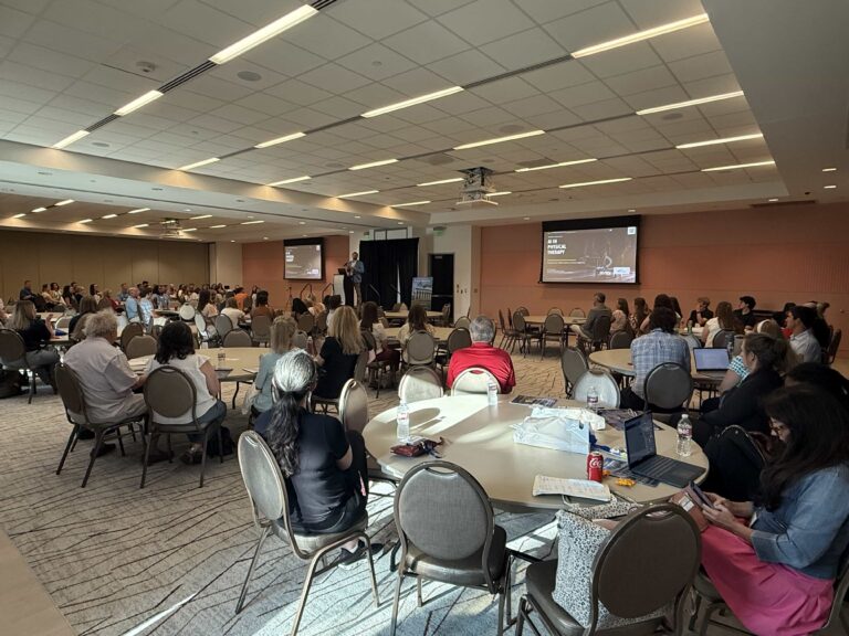 Physical therapy professionals watch Dr. Kollin Napier present AI in Physical Therapy at the 2026 APTA-Mississippi Fall Conference in Biloxi.