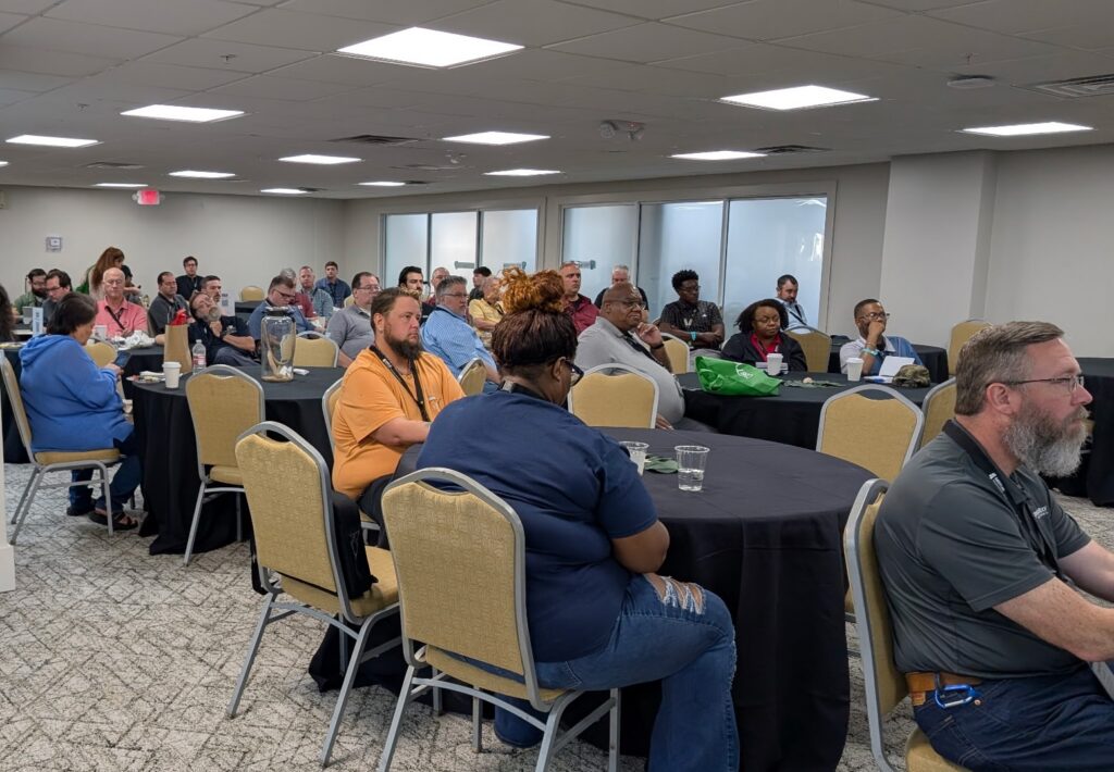 MSTUG Fall Summit attendees seated at round tables during the Saturday morning session.